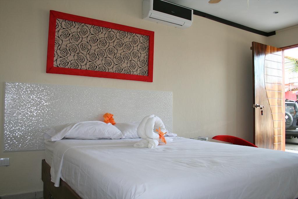 Tuanis Aparthotel Jacó Zimmer foto